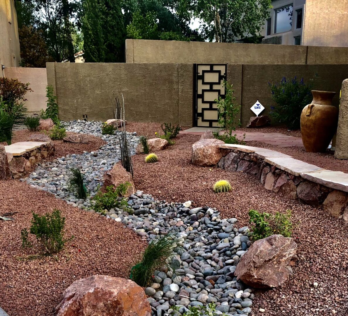 A garden with rocks and plants in it