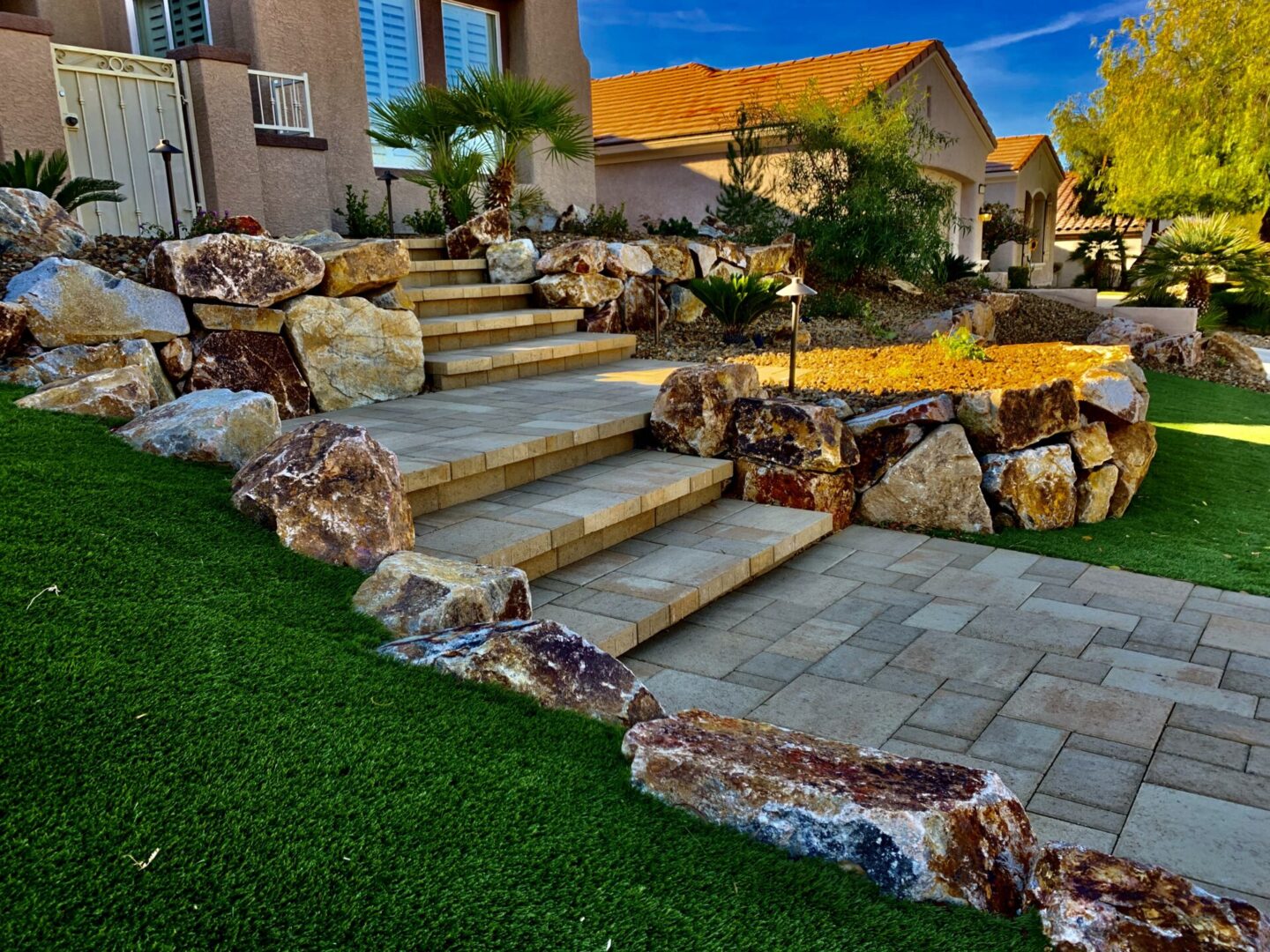 A garden with steps and rocks in the middle of it