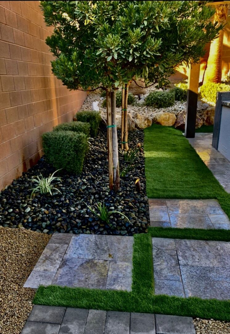 A garden with grass and rocks in it